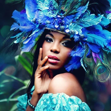 If you let me, I could make your dreams become reality <br />
<br />
This was shot in Jamaica and inspired by the colors and flamboyancy of Peacocks. I created the head piece using peacock feathers and multi colored feathers as well as gems and jewels. The dress was a vintage piece that I picked up at a used clothing store. I love how this whole shoot turned out, not to mention the model was just fantastic! <br />
Model: Walleisha Burte