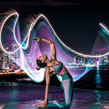 Playing with continuos neon lights and fire at the same time we achieved this great and long lasting yoga pose. Very challenging but very worth it.