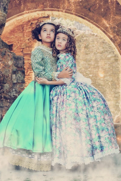 The English Roses, photographed in the heart of Hampshire, England. Two princesses from England and Puerto Rico modelling classic custom gowns to express the gentle tale of royalty.