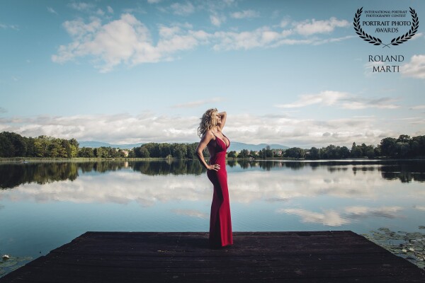 This picture was taken in front of a very small but beautiful lake. I like the red Dress in front the blue Sky.<br />
<br />
Photographer: @roland_marti_photography<br />
