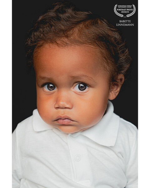 Seven, sweet little boy of almost 1 year old. his innocent look melts me. This age is great for shooting.