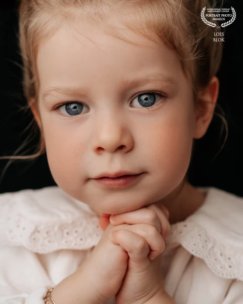 “Romee in Portrait” love those hands and her big blue eyes. She is 2 years old.