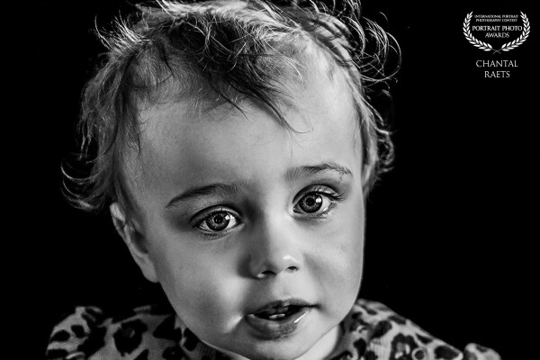 In those innocent eyes lie stories untold, dreams unspoken, and a world yet to be discovered
