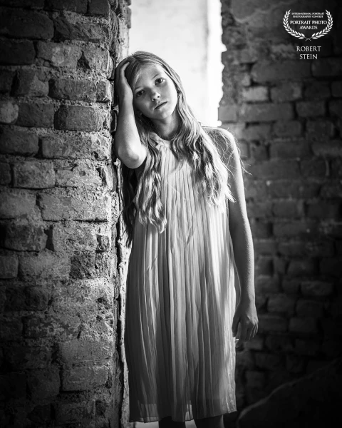In 'Contemplation in Stone,' I positioned my subject within ancient brick ruins to create a dialogue...