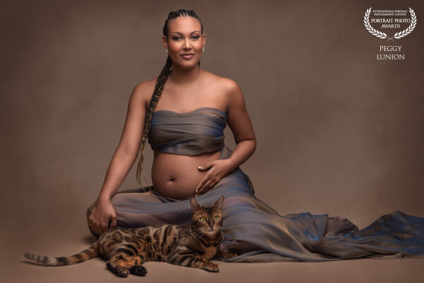 A glowing mother to be, graced by the gentle presence of the photographer’s cat who wandered in as i...