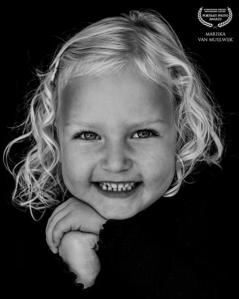 A clear and calm portrait, photographed without added styling or posing. The simplicity of the image allows the subject to speak for herself.