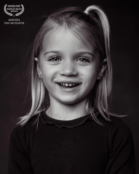 My oldest girl. 
All the light she needs is her smile.