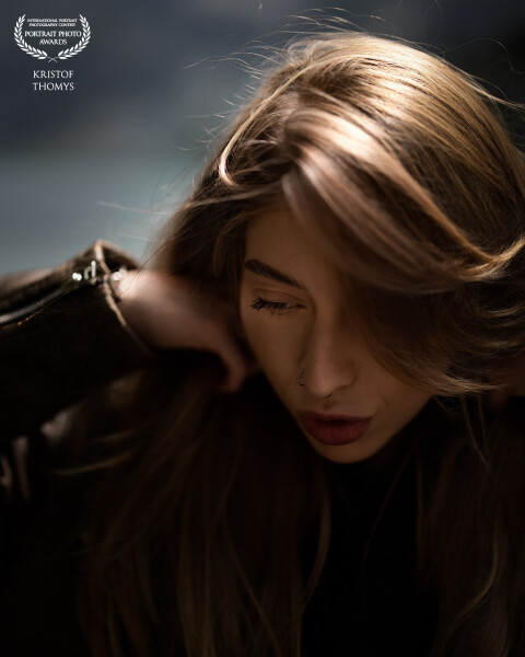 At the edge of the Swiss Alps.
The wind moved first, then the light, then her hair.
Her eyes closed,...