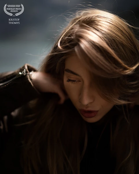 At the edge of the Swiss Alps.
The wind moved first, then the light, then her hair.
Her eyes closed,...