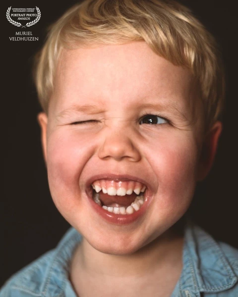 “This photograph is all about genuine spontaneity. The wink brings together playfulness and characte...
