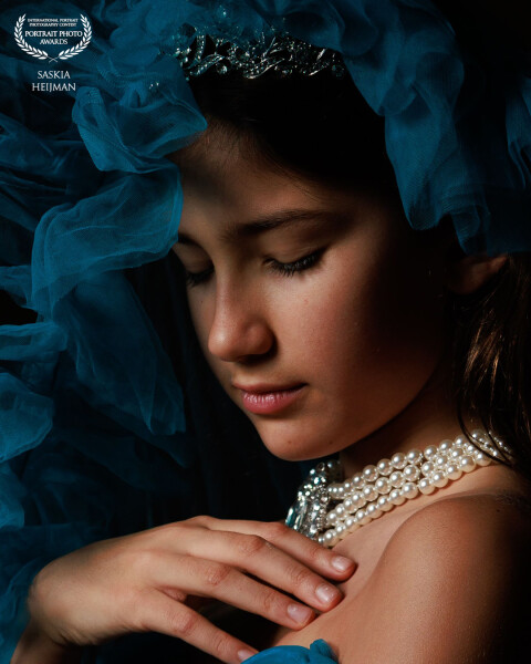 Award Winner: Rosalie
A serene and captivating portrait, beautifully captured beneath a veil of blue...