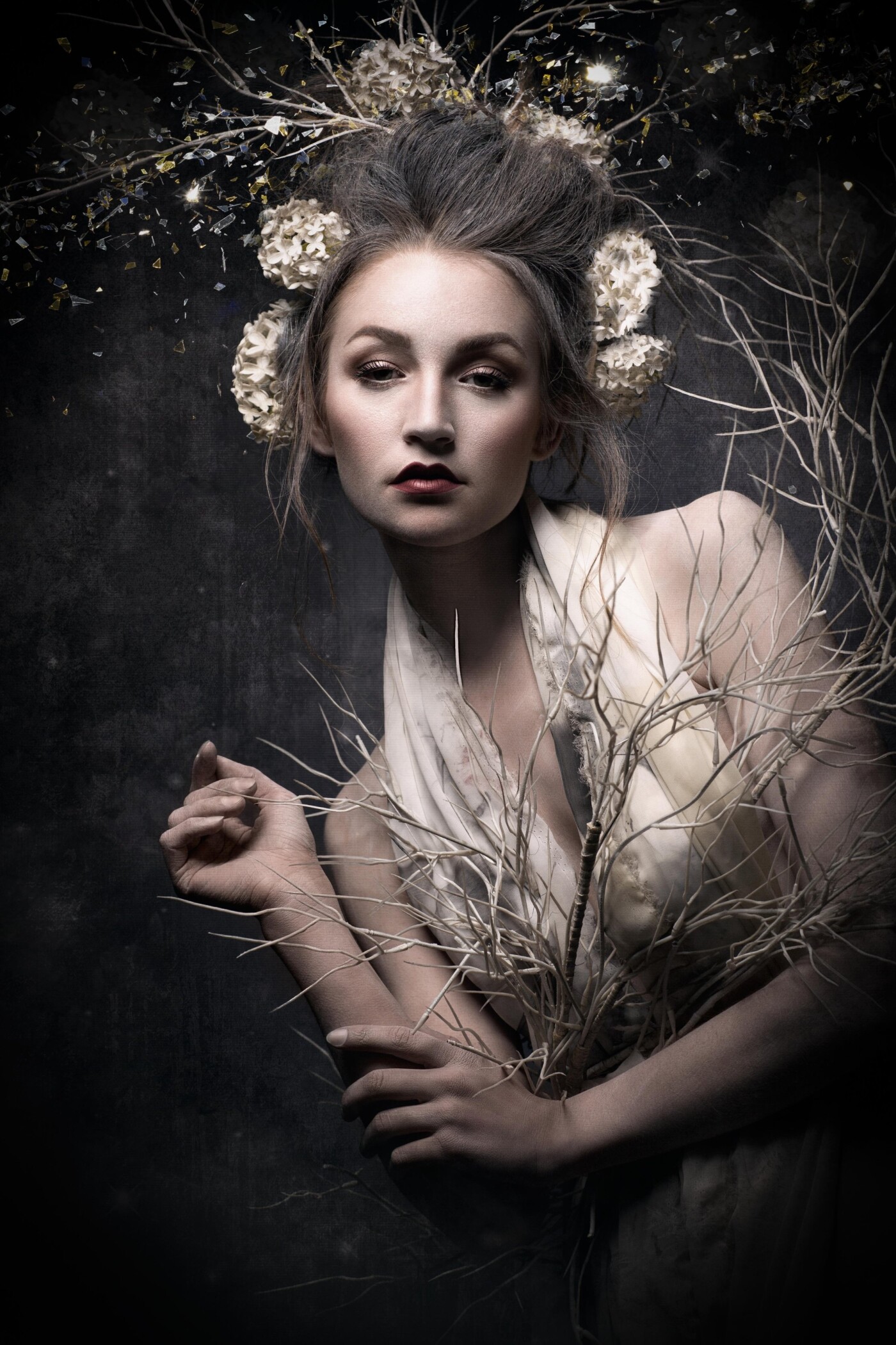 This portrait was a surprise for me. During the shooting, I was not so impressed with the styling. I wanted more blooming flowers. Therefore, the picture remained unused for a while. Then came the idea to create a winter image. White branches and white flowers and a few crystals and ice. Unbelievable, how it played out in the ends :-)
