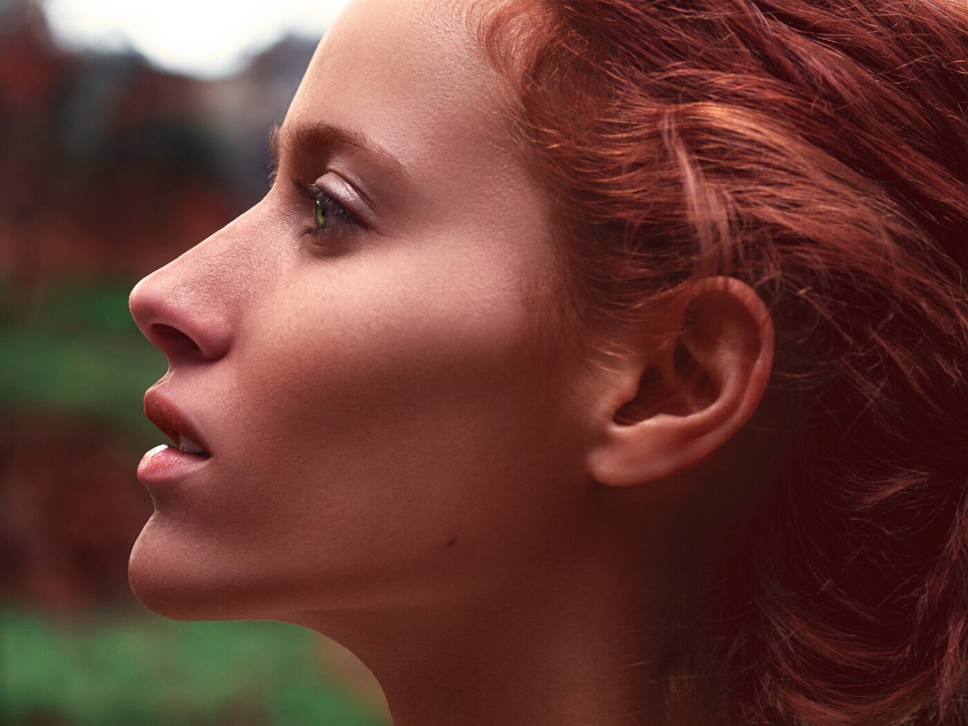 A photo from one of my earliest shoots where I was trying to create a portrait of a redhead in nature while focusing on the perfect anatomy of the face and the emotional gaze.