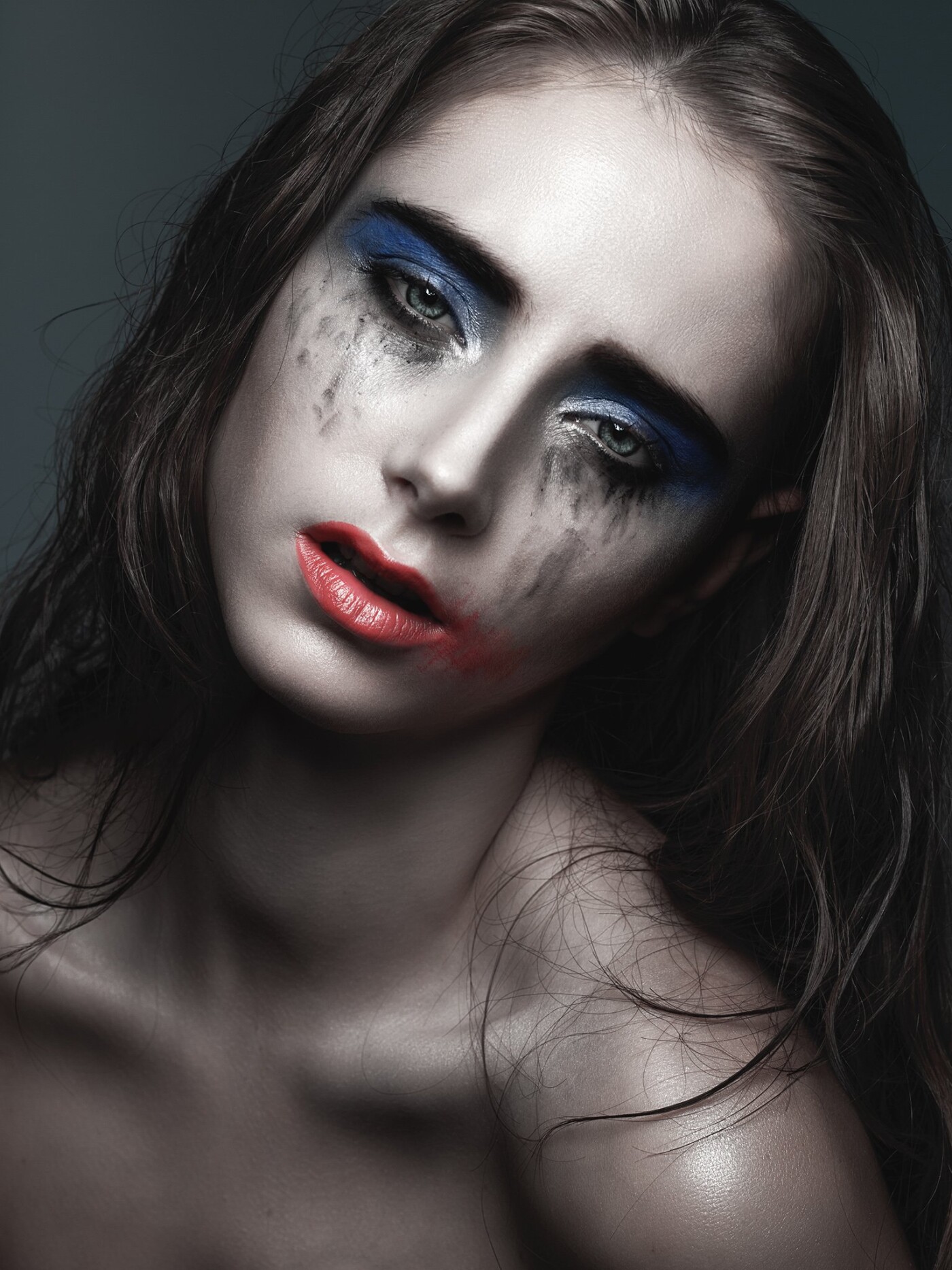 A concept art portrait called "The Weeper" while creating high-fashion in Milano. PS toning took the creative makeup an extra step by creating a pale desaturated skin while enhancing the makeup effect. 