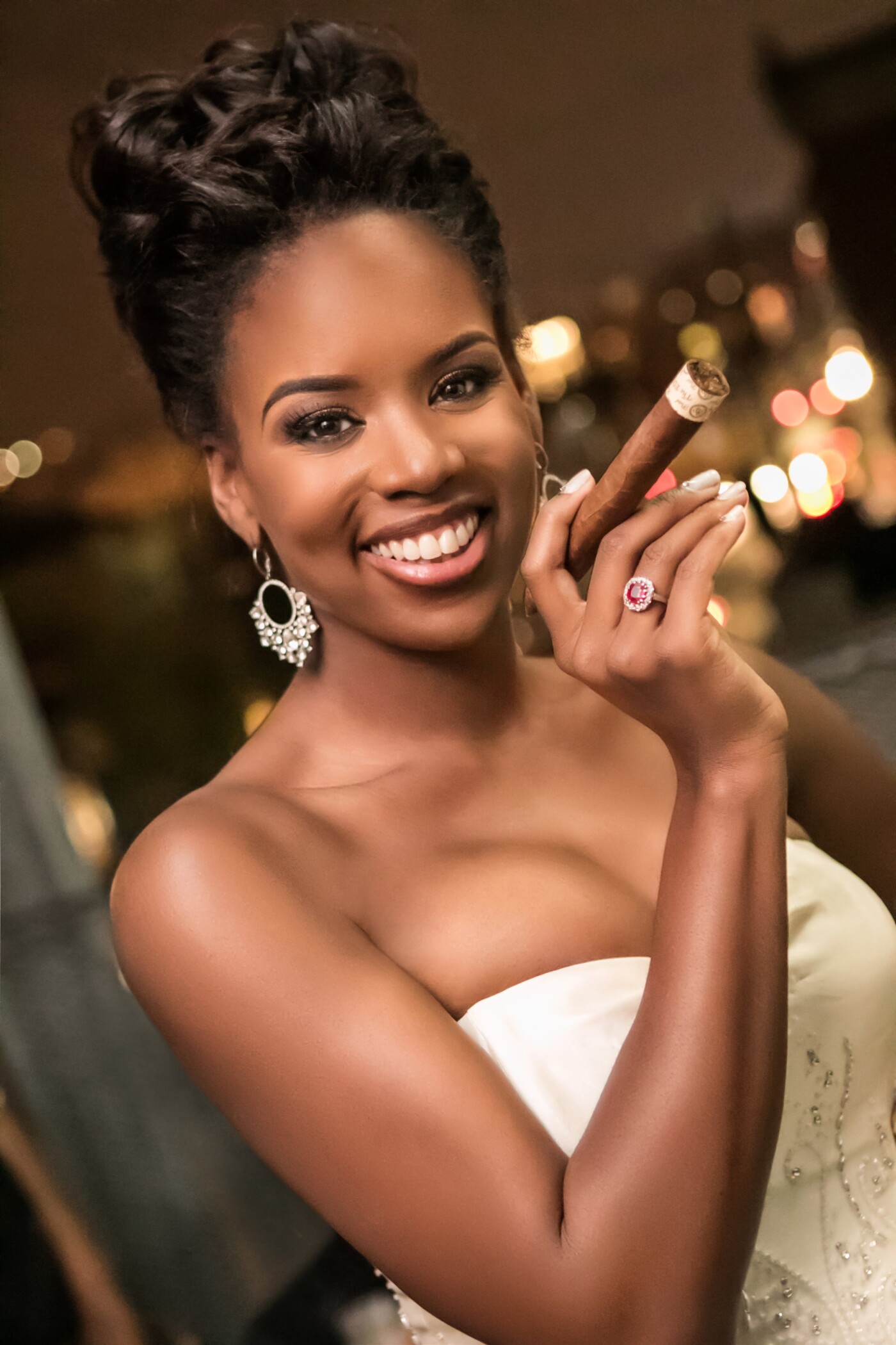 This image was taken during a wedding reception at the Pittsburgh Glass Center.  The beautiful bride walked into her groom's cigar bar, grabbed a cigar and turned with a smile on her face.  In that instant, a moment was captured that will last a lifetime.