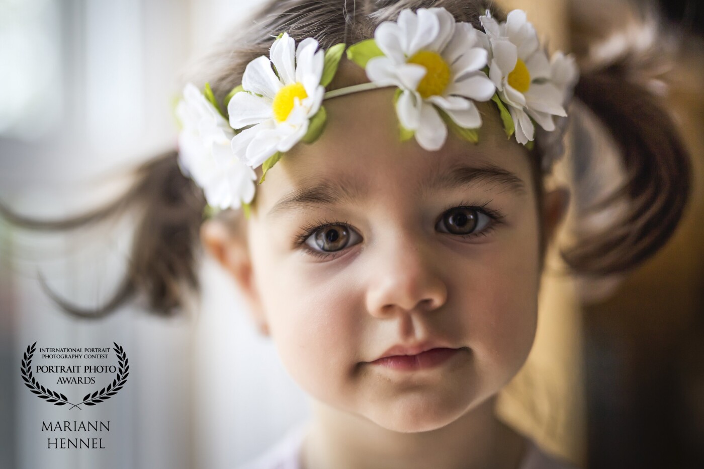 I took this photo in a break of a newborn session. This little beauty was so curious about what I was doing.<br />
(My model was originally her baby brother.) I found this flower headband in her staff,  put on her and asked to look at the camera.