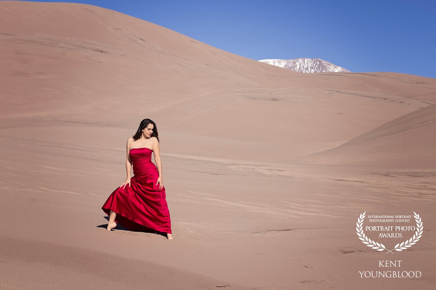Deserts can make for very dramatic and beautiful landscapes and the Great Sand Dunes National Park in Colorado fits the bill. I wanted to balance the scale of the dunes with a small splash of red. The contrast in size and color of elements makes this one of my favorite shots.
