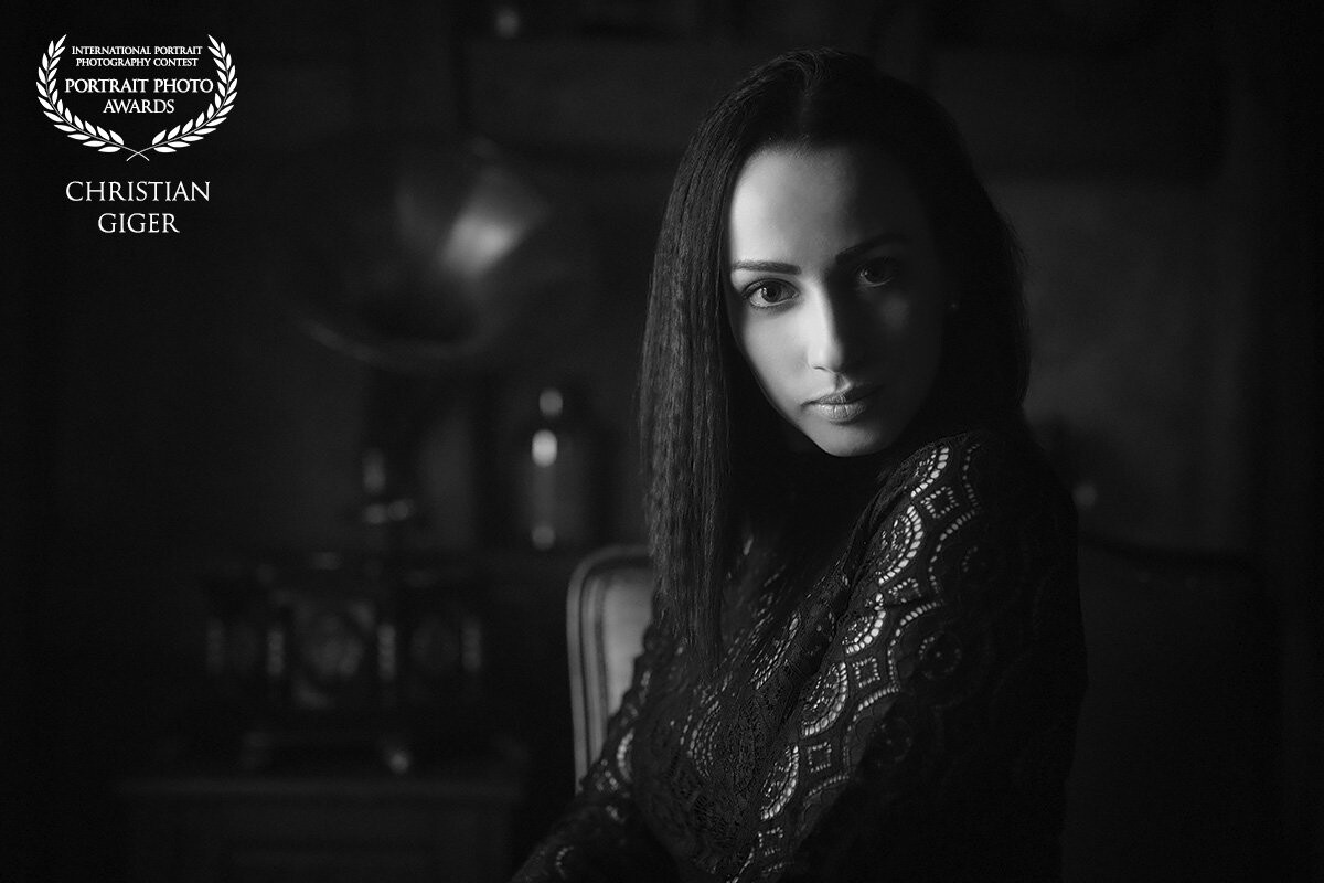 "Portrait of Deborah"<br />
Since Deborah (Model & MakeUp Artist, FB @deborahjoergermakeup) is a calm woman I was aiming to show that in the portrait. I decided to do a series of black&white portraits, dark and a lot of black, with available light indoors. 