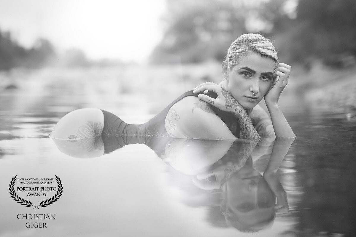Bianca and I decided to got for a short 2 hour shooting down to the river. <br />
For this portrait both of us were lying in the water - my camera and lens just a few centimeters above the water surface... <br />
<br />
P: @Christian.giger.photography  (FB+IG)<br />
M: @bibiqwa (IG)<br />
<br />
www.cg-photography.com