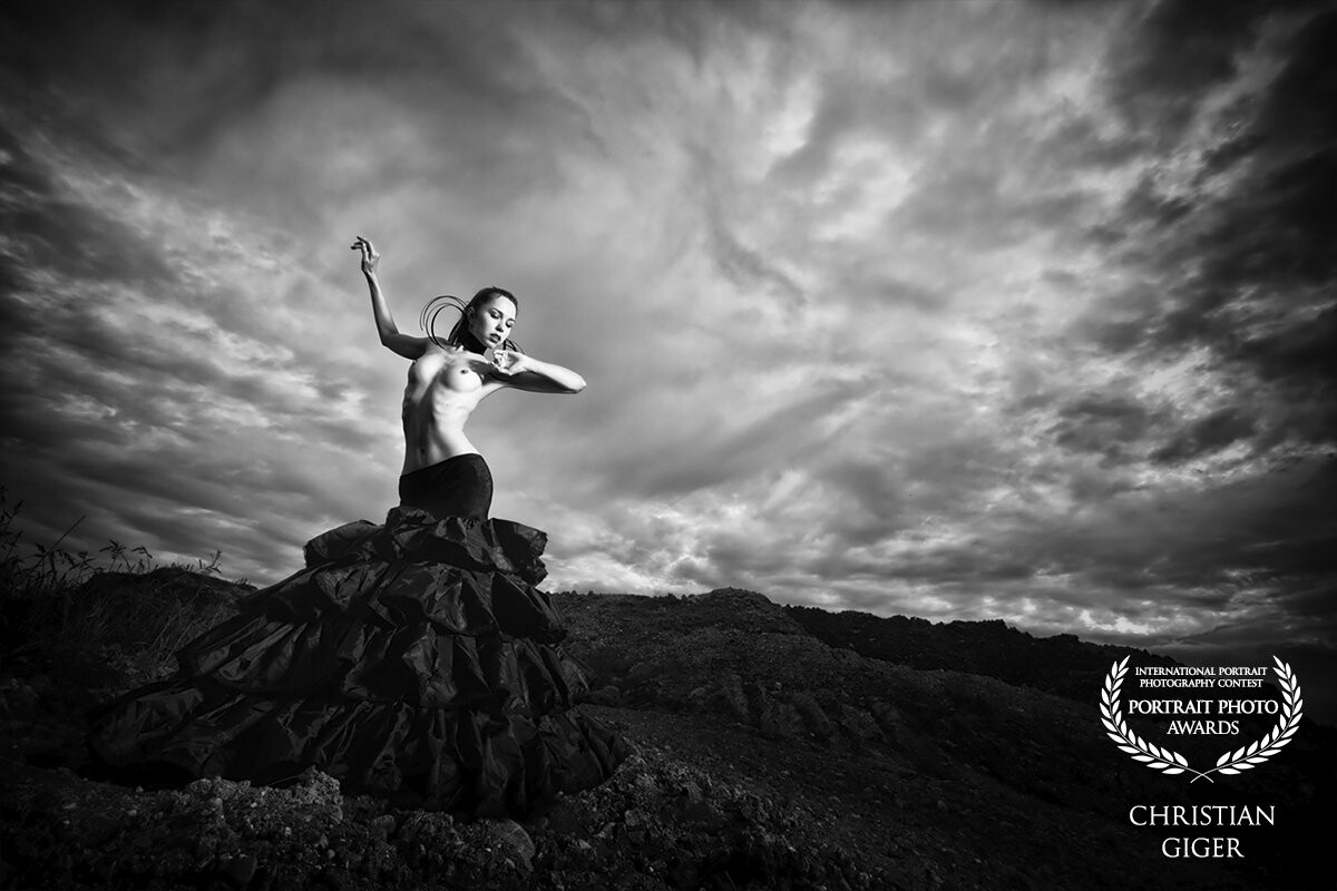 "dark clouds"<br />
With Lana Pictures like this one is (almost) a piece of cake. She is such a graceful person. Add some unusual clothing and - lucky us on that day - a dramatic sky.<br />
<br />
We used a portable flash system with a 100cm deep octa.<br />
<br />
P: @christian.giger.photography (FB+IG)<br />
M: Lana Kitevs @lana_model (IG)<br />
<br />
www.cg-photography.com
