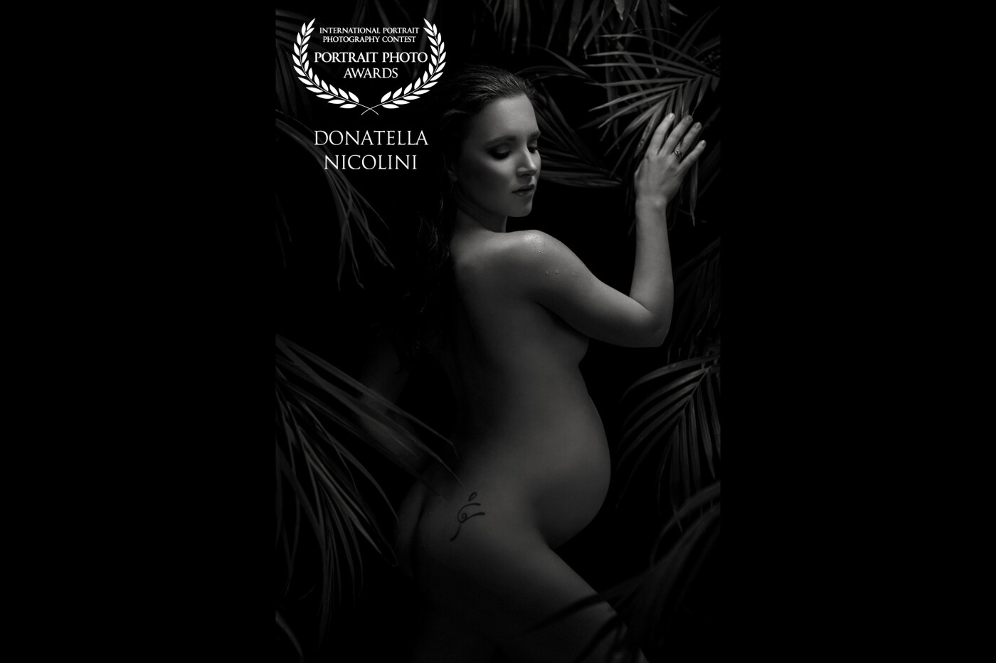 This photo was taken in my studio in Milano, Italy. I wanted to create a wild, jungle environment, using real palm leaves that I positioned on different levels and distances, showing the connection between the beauty and power of nature and the miracle of pregnancy. <br />
This image was shot on a Nikon D750, using Nikon 24-70mm f 2.8 lens.