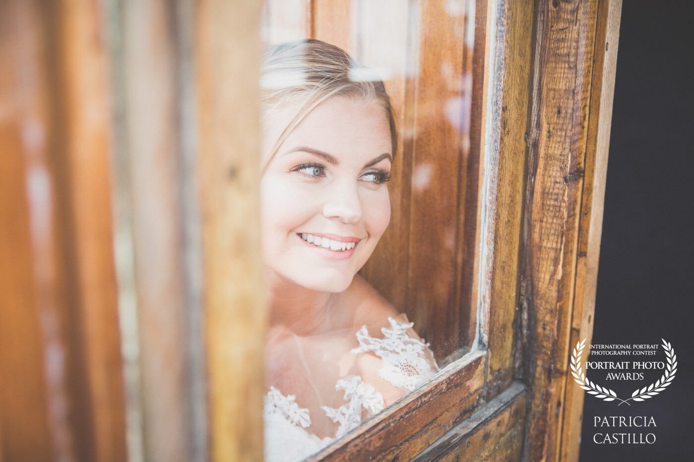Matilda on her wedding day. This image is taken on an old boat in the archipelago of Stockholm. Matilda was waiting with anxiety her man-to-be: Andreas, trying to hide from his sight behind that mistique old window ... like a little child ... like the most beautiful bride ... 