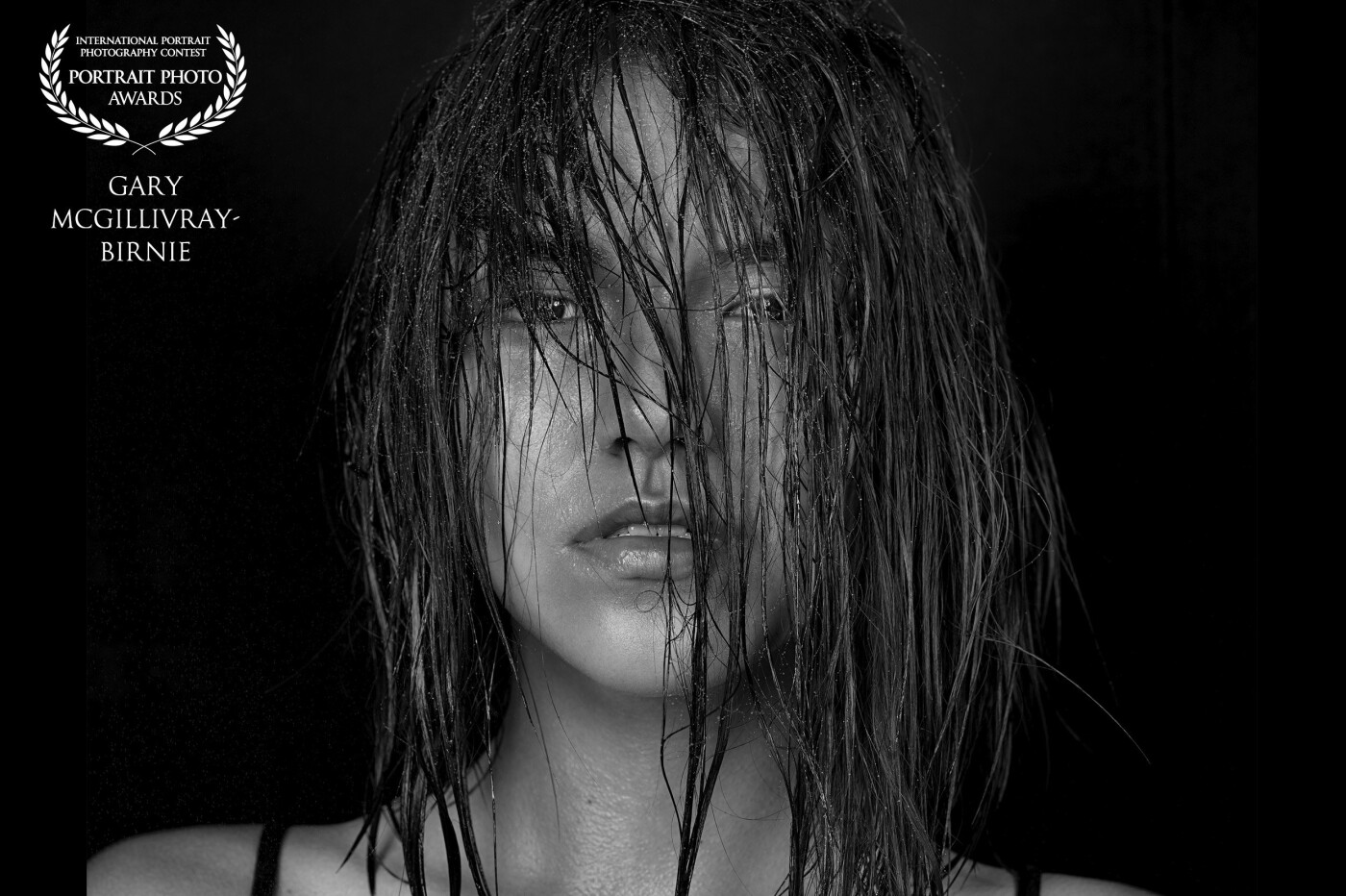 This image was transpired after the initial 4-hour photographic session with a local artist and his artwork.<br />
In this closeup shot, the model shows off her beauty, even with no makeup and only dampened hair. <br />
<br />
Photographer: Gary McGillivray-Birnie<br />
Model: @lebedeva.polina.lp @ks_models_atyrau <br />
<br />
Hasselblad H6D-50c Lens: 150 mm<br />
ISO: 100, Aperture: f/11, Shutter: 1/320s <br />
Lighting: Profoto D2 with 5' octabox and B1x with 3' octabox<br />
<br />
www.mcgillivraybirniephotography.com<br />
Instagram: @mcgillivraybirniephotography