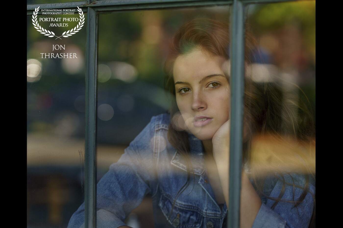 This image of the teen model, McKenna Driscoll (instagram.com/mckenna.driscoll), was captured in the Historic Southend neighborhood of Charlotte, NC.,  through the windows of the new Superica Restaurant. This historic building was once an old textile mill and when recently renovated, the old brick structure and industrial windows were left intact creating some excellent photo shoot locations. McKenna is represented by MP Miami (instagram.com/mpmanagementmiami).