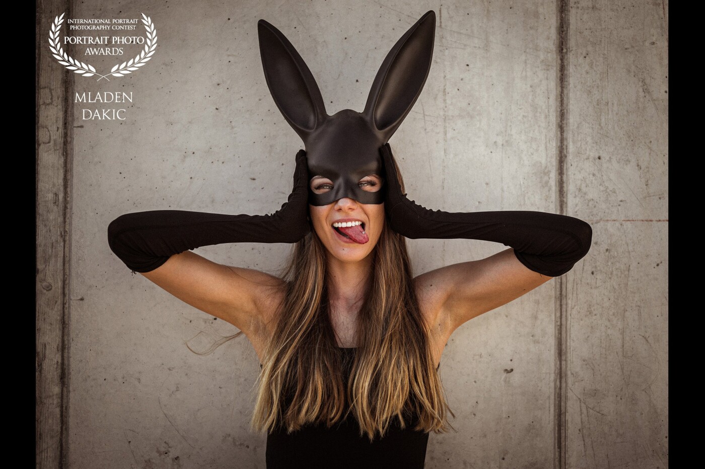 "I wish to have some pictures with a bunny mask". With these words of my model beauty Vani we started our project bunny mask. It was a hot summer saturday when we made this pictures on a rooftop parkig. We had a funny afernoon and I think it is visible in the pictures. This photo one is my absolute favourite because you can see the mood on the set. I called it "Bunnies have fun". I used natural light only.