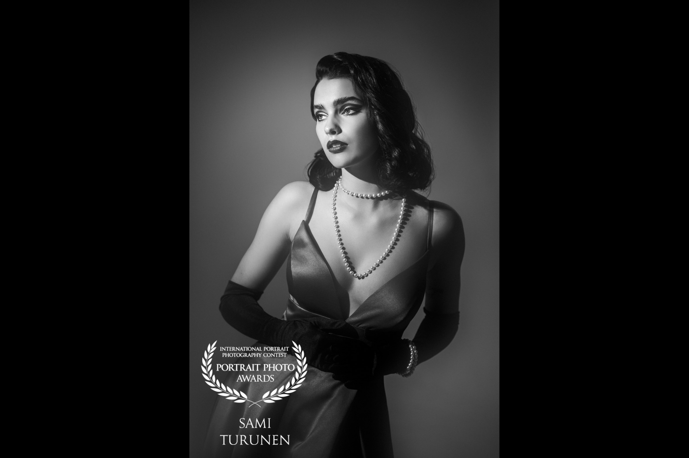 Film noir theme and Hollywood light. Shot with a hard bare bulb light and used soft focus filter to create glow & bloom. Model is amazing Oona Antila and our talented stylist Nina Vuori.