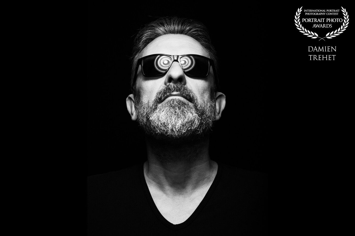 The Hypnotized Guy. <br />
I used the reflection of a beauty dish on the sunglasses to replace the eyes.  The beauty dish used is a demi Mola to have this effect of multiple concentric circles.