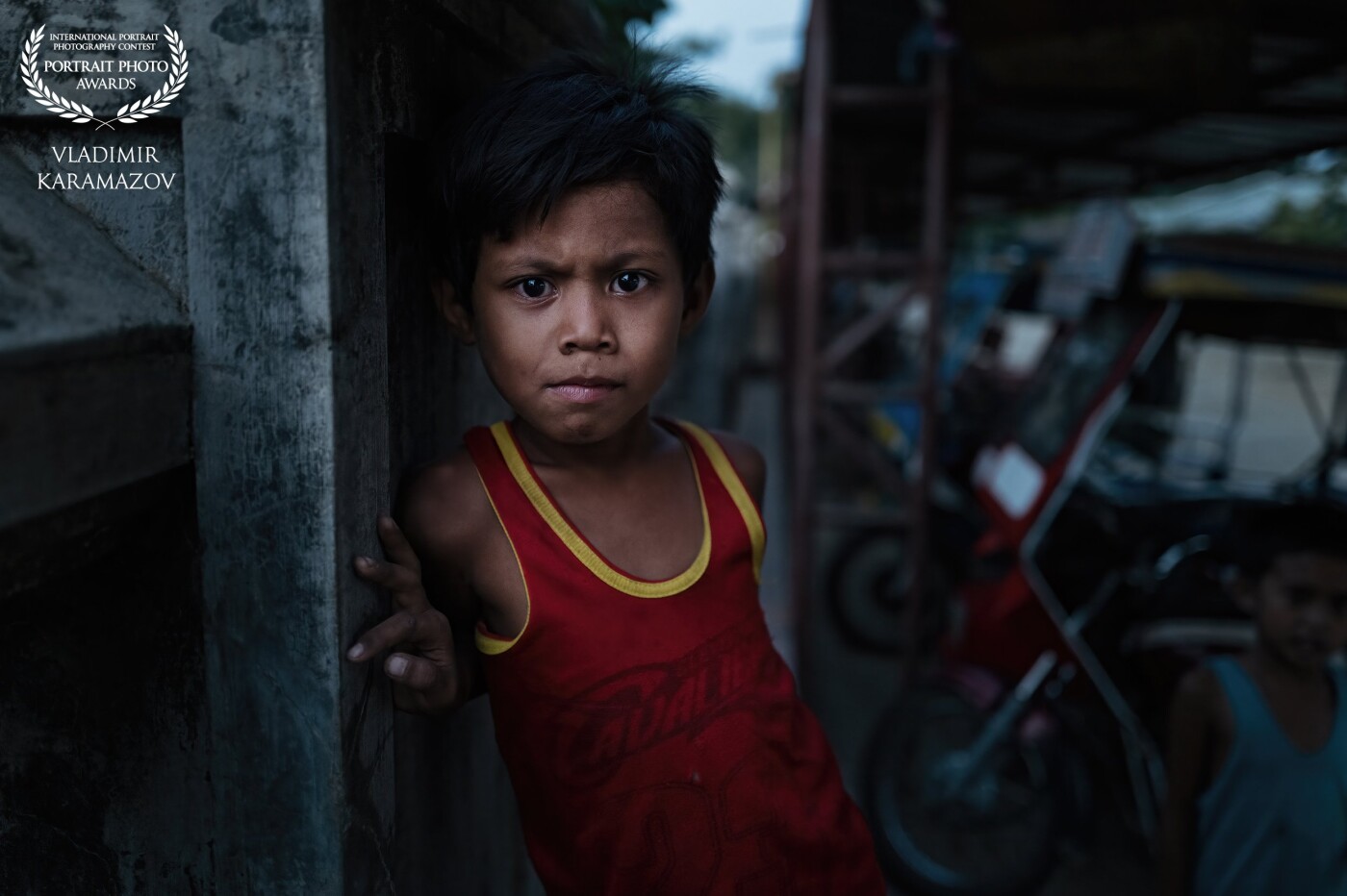 I met this child at a market in a village in the Philippines.  He really liked me taking pictures of him.  Among his many expressions, I chose the most angry.  Thus the child shows that he will become a strong person.
