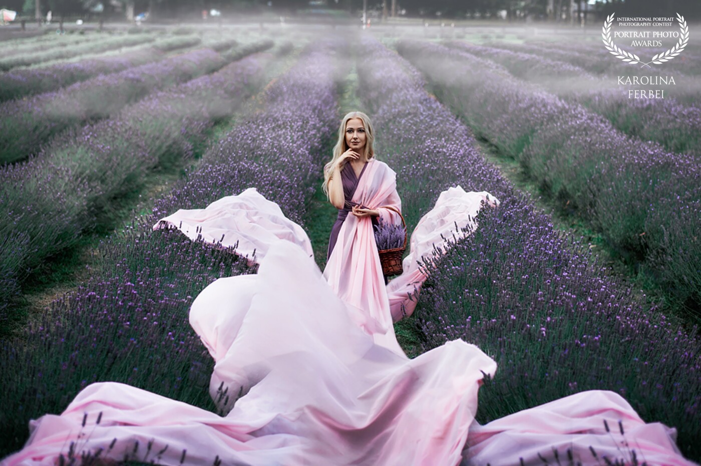 Beauty in lavender field. I love creating goddess look images. This location was perfect for a purple-themed shoot.<br />
On the day this shot was taken it was bright daylight and sun was hiding behind the clouds only few times. So we had to hide in a shadow of trees, that luckily were in front of the field.<br />
When sun is out all colours pop and shadows become very harsh. It suits for some types of photography, but not mine.<br />
Anyways with a bit of struggle we got pretty good shots.