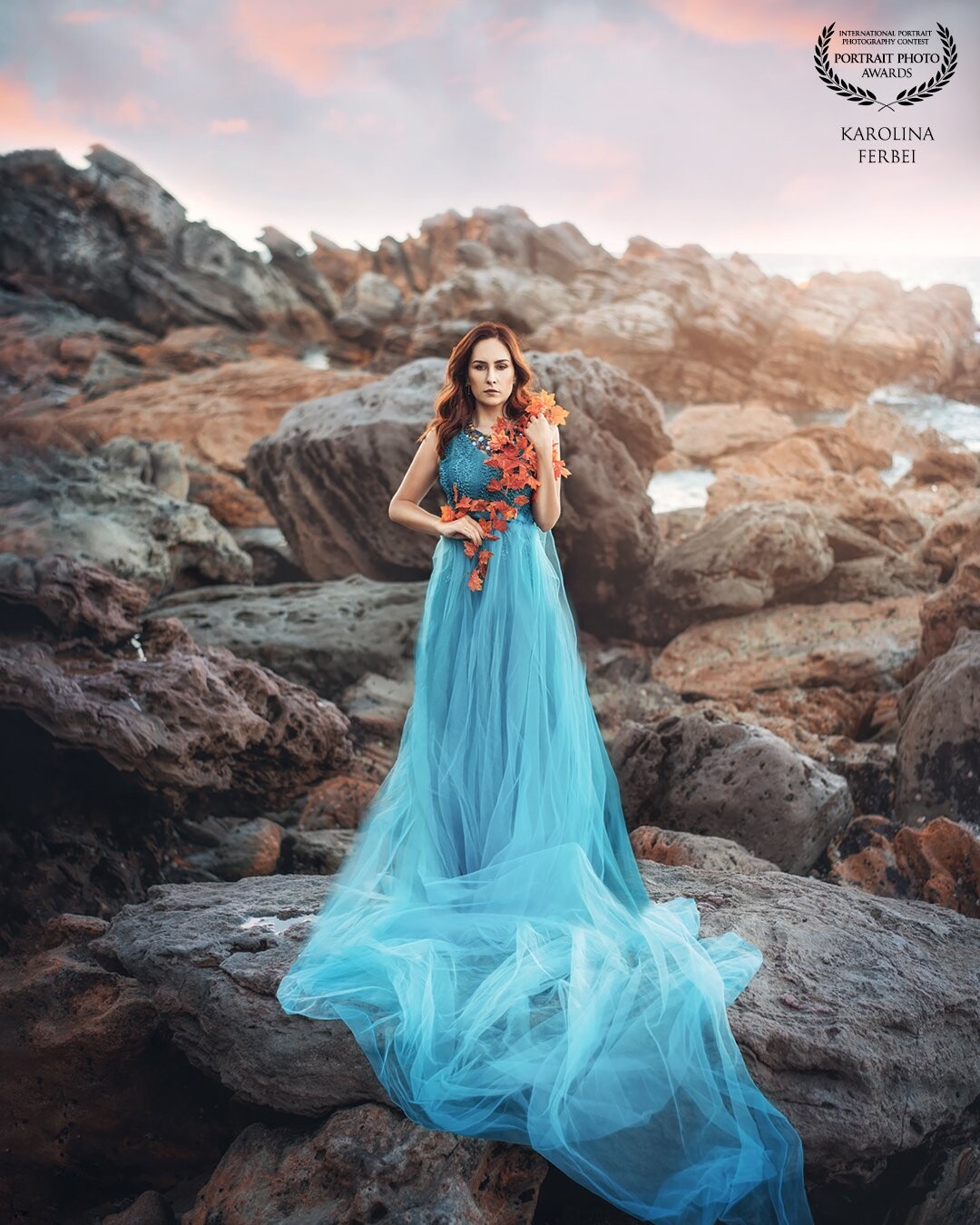 This beautiful location was an inspiration for this shot. Sky blue dress is going well with brown rocks and ocean's blue. <br />
It turned out to be a sort of sea goddess, who just came out on land.