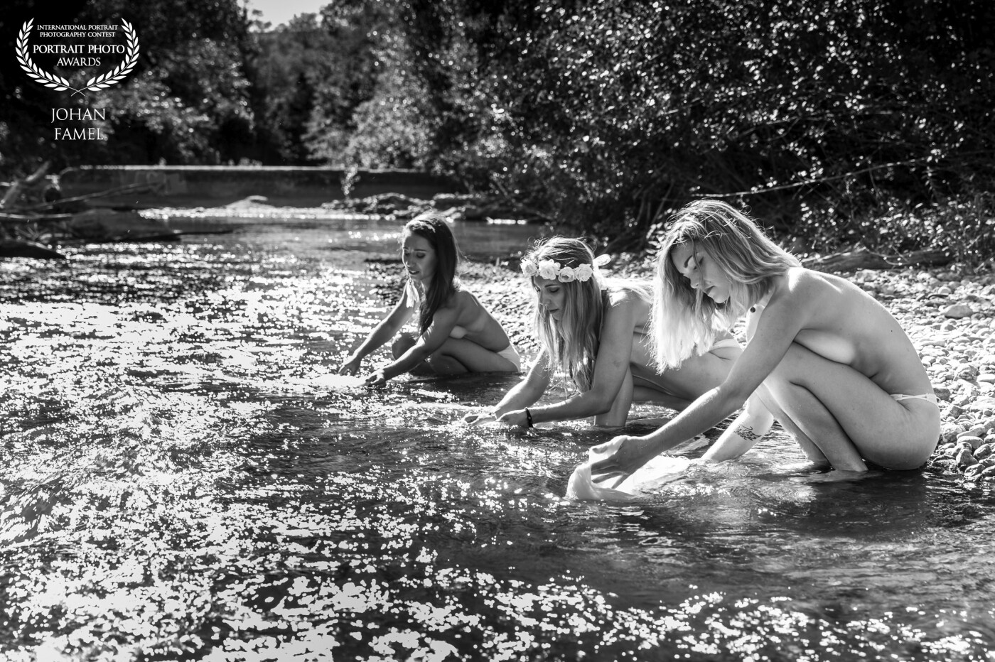 A photo project made around a hippie theme. 3 young woman blooming naked in the middle of summer with their feet in the river.<br />
In full action, wetting their laundry