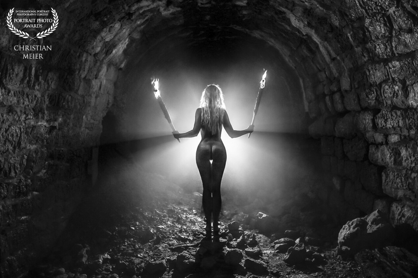 It is dark, damp and cold in the old, half-collapsed mine tunnel.<br />
The light only comes from the two self-made torches and the miner's lamp in front of the model.<br />
The "fog" is a product of my not quite professional torches. ;)<br />
<br />
Who finds the heart?<br />
<br />
Model: Rachelle Utzinger