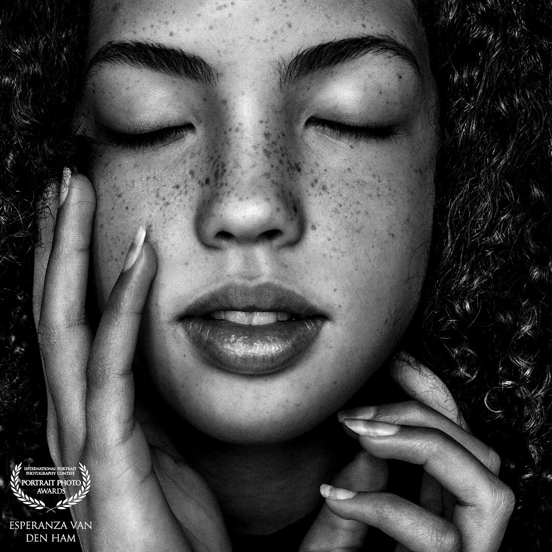 Jalisa, this is one of my favorite black and white potraits. Normally I focus on the eyes in most of my portraits, but for this picture i choose to keep them closed. Why? Because her hands, face, hair, hightlights and great lips falling into one perfect piece!