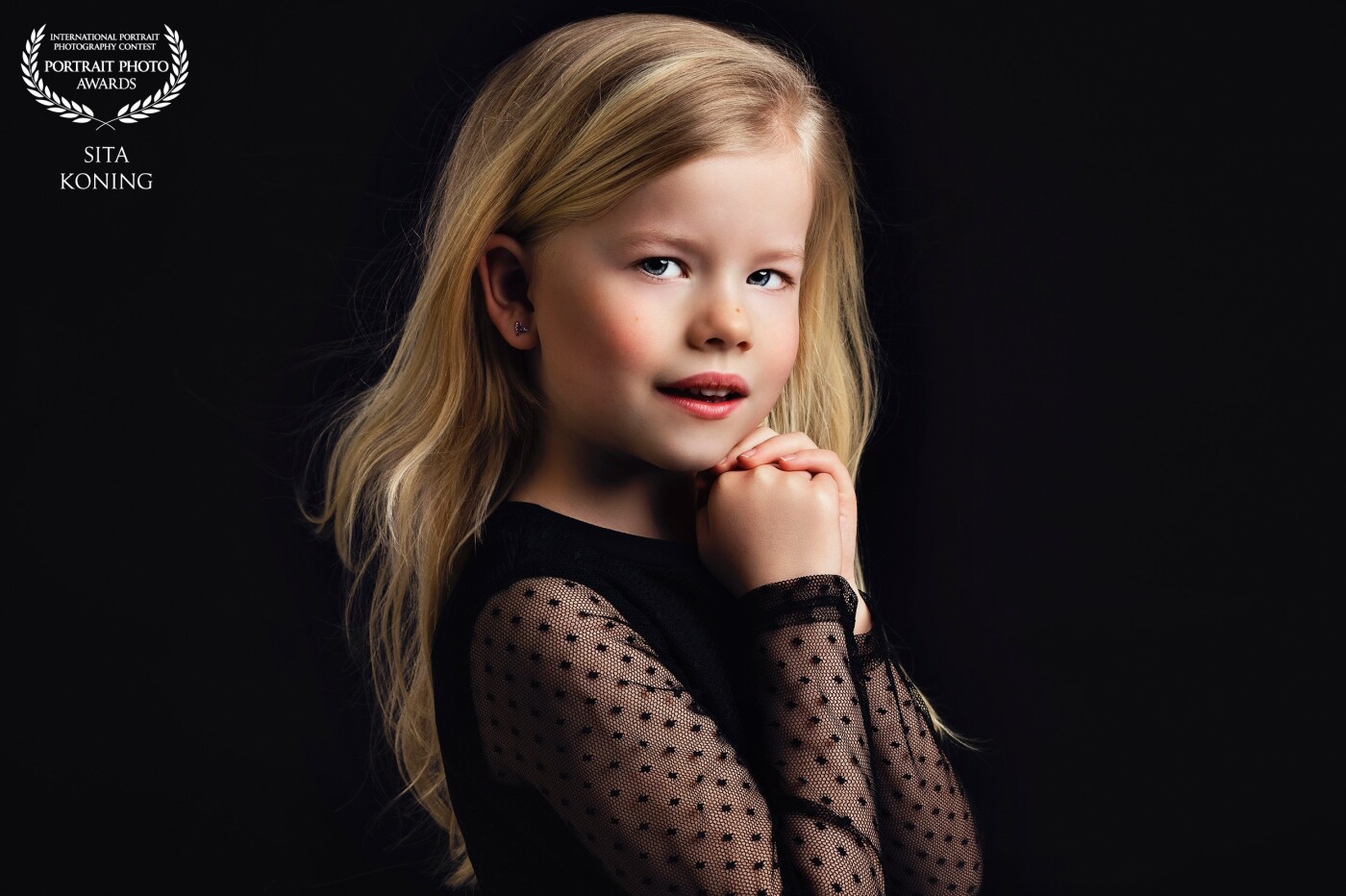 This beauty came to my photostudio with het little sister! So cute! I love the look in her  eyes! So pure and serene with the black background