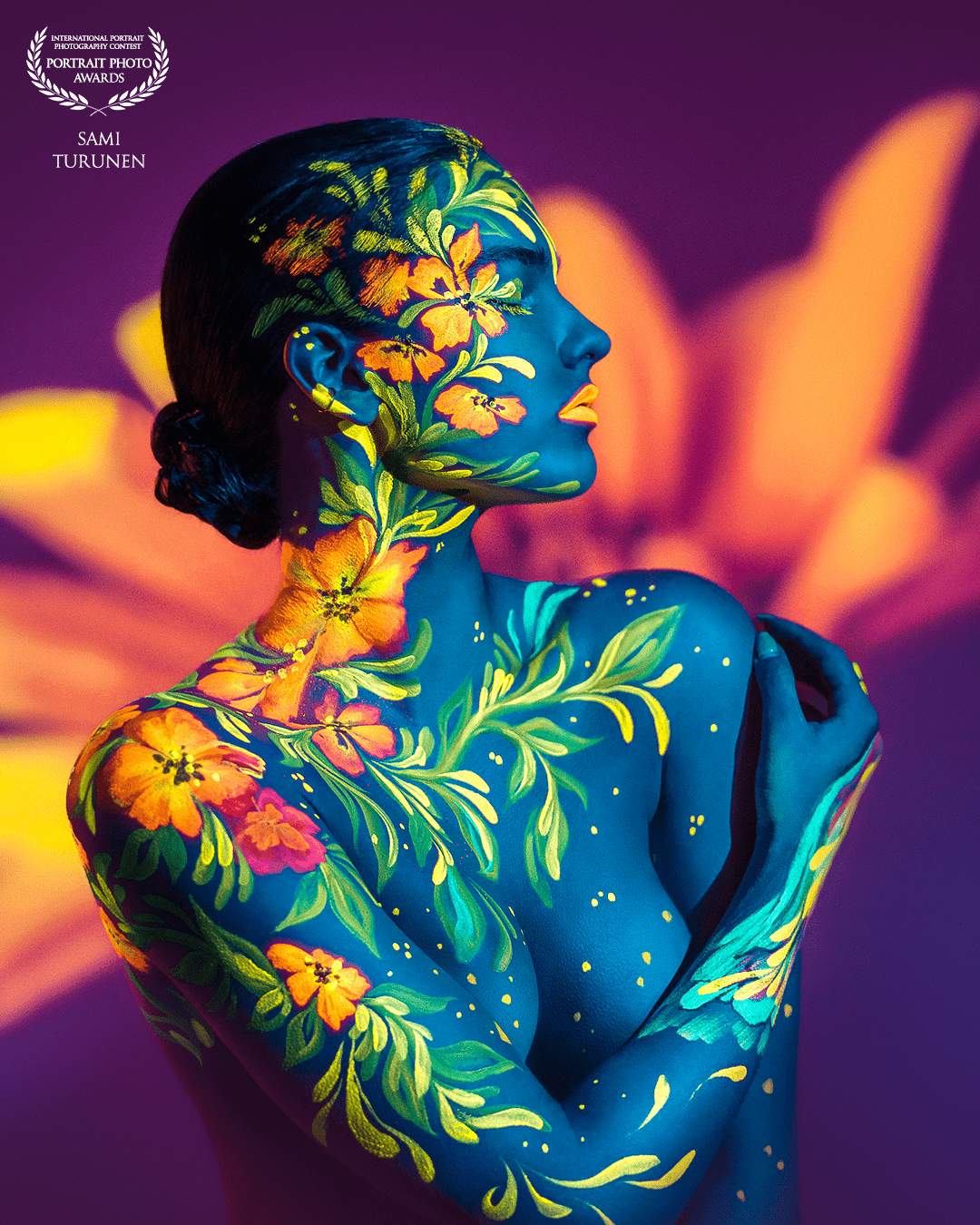 Human Nature is a creation of wonderful team work with model Oona Antila and body painter Riina Laine. A frame is shot with a UV lights and video background projection.