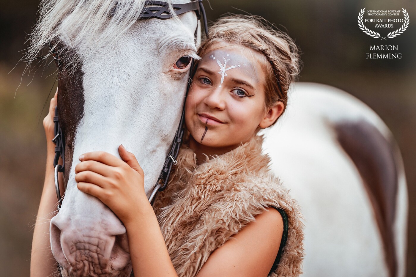Little Viking <br />
<br />
Elisa and the spotted horse Tino during a photosession.  I love the details in the horse-eye and the beautiful make-up