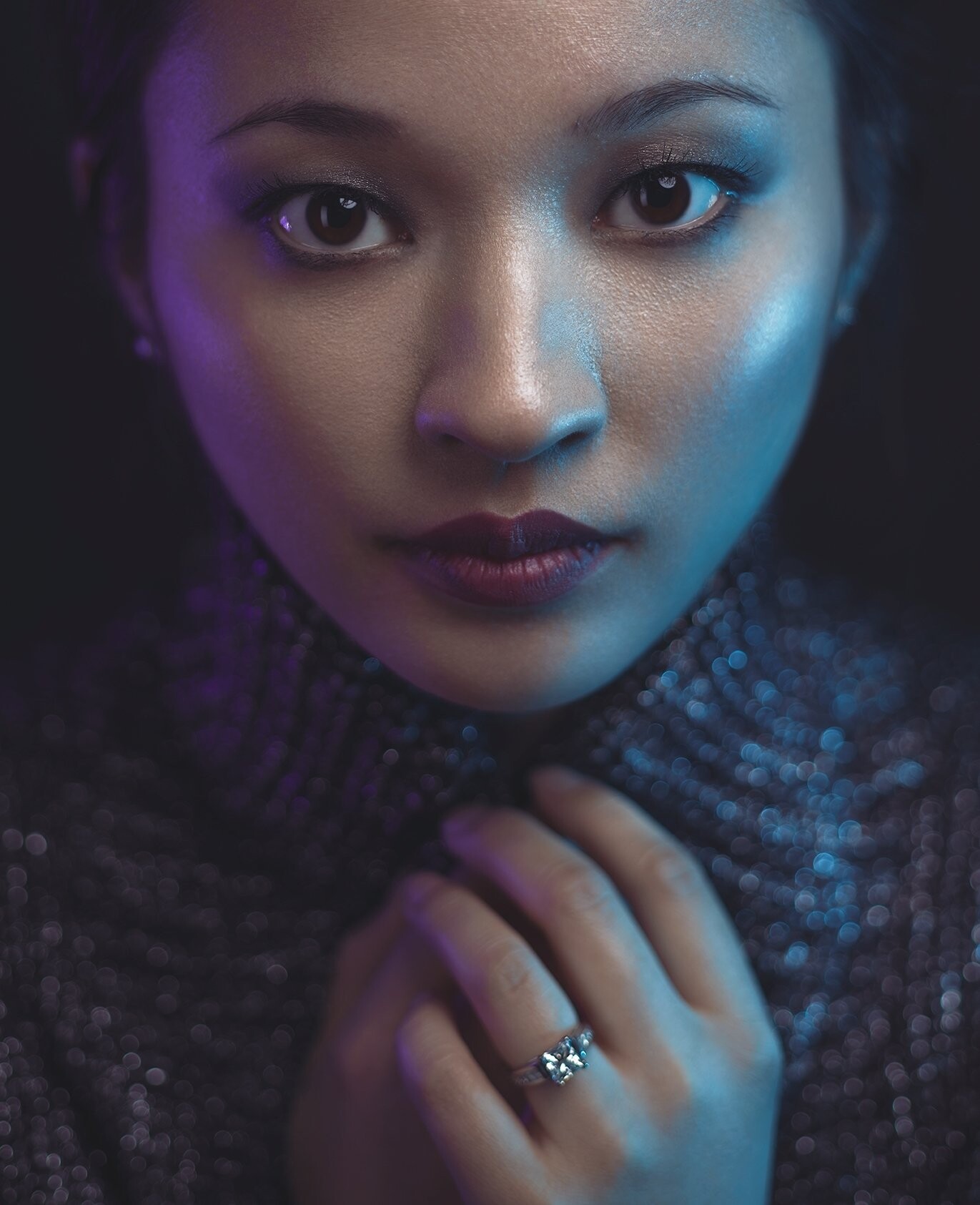 This photo is titled "Engagement"...and is one of my most intimate works - amazingly talented model. As for interest, the colors purple and blue were selected to convey certain hidden expressions. Purple represented mystery, uncertainty, but hope. Blue being the lighter side... defined having faith, to trust, and confidence in commitment. There is a double subject matter where the attention travels between her and the ring. 