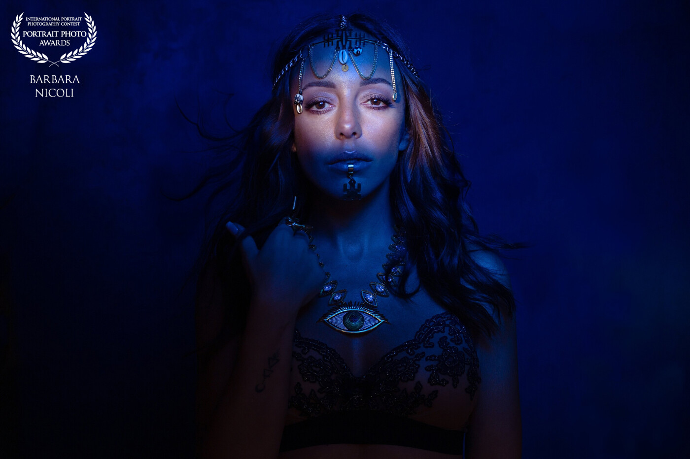 Adassiya is a French singer-DJ and producer. His music and personality inspired me this shot ! I use an optical snoot and blue gel with my Profoto light and beauty dish. I really love this shot !