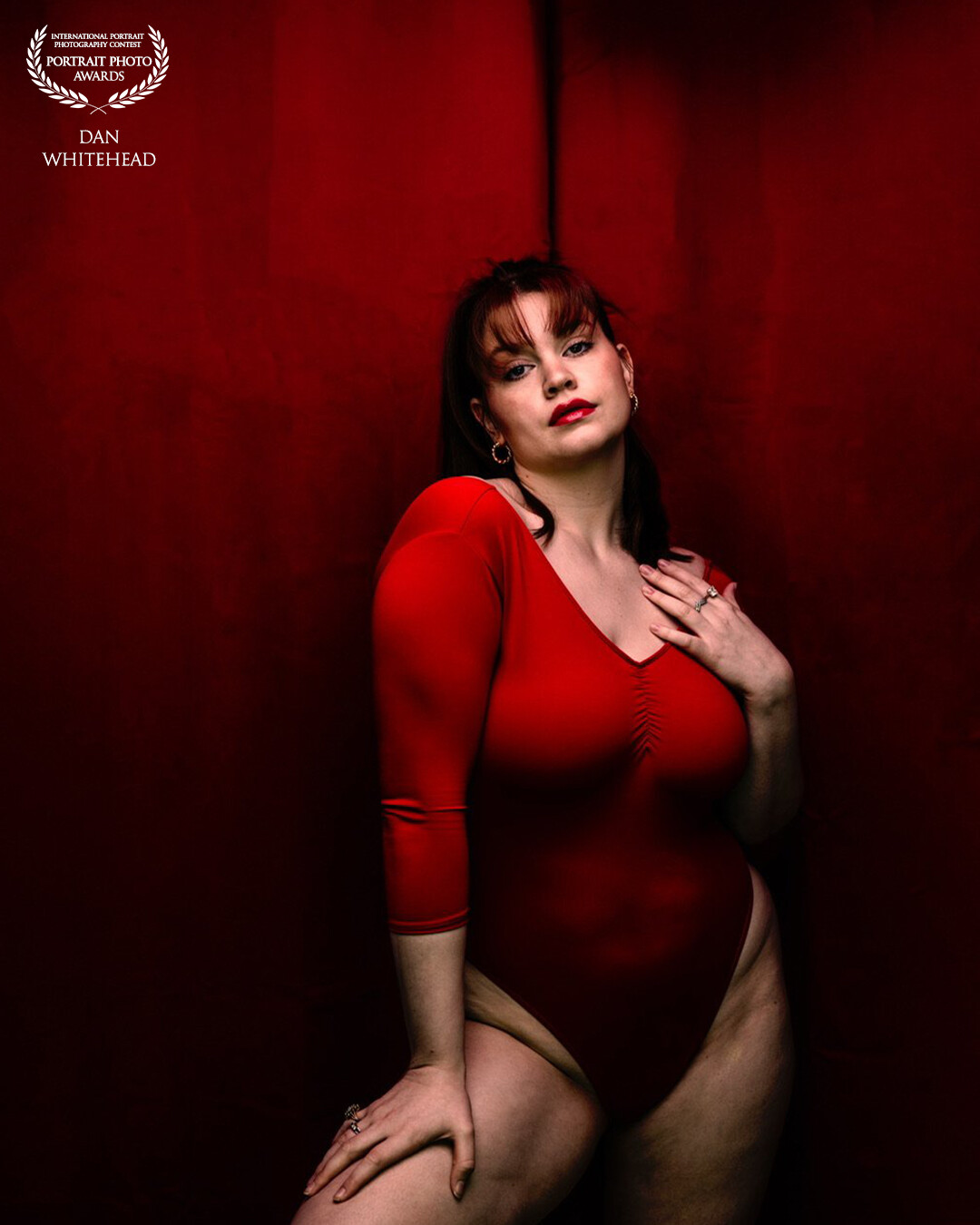With this photo the subject (Kara Byrnes) and I wanted to do a monochromatic image with a single color. This color of course being red. She had this body suit with her, and I had two red Amazon curtains that I hung up to be outlet backdrop. In photoshop I smoothed it all out to appear as a single piece. Shot with my Canon R5.