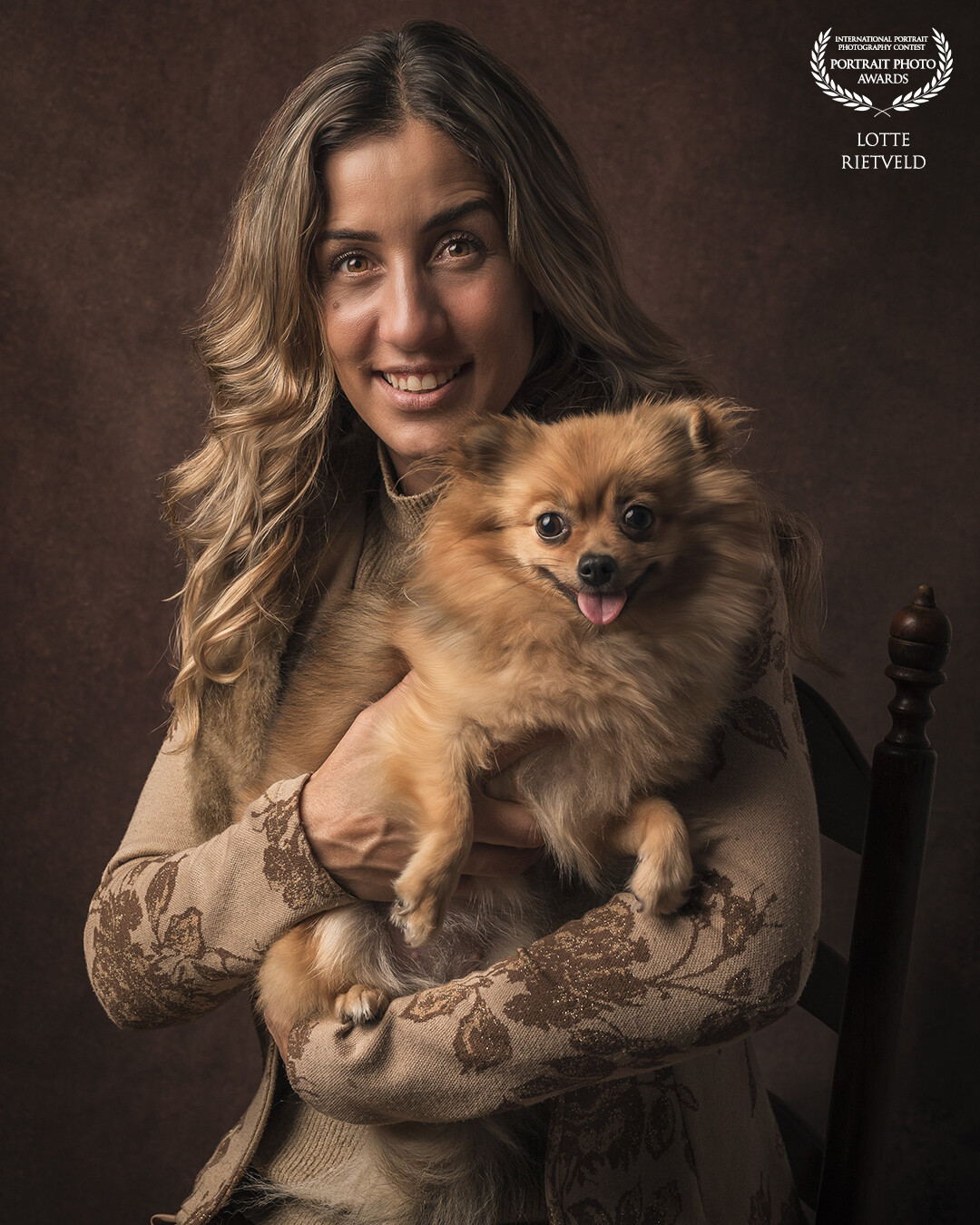 Fine Art portrait of Warda and her little dog Lou Lou, a small, cheerful Pomeranian. The elegance and friendship between her and her dog, combined with the subtle colors, make this portrait a delight to look at.