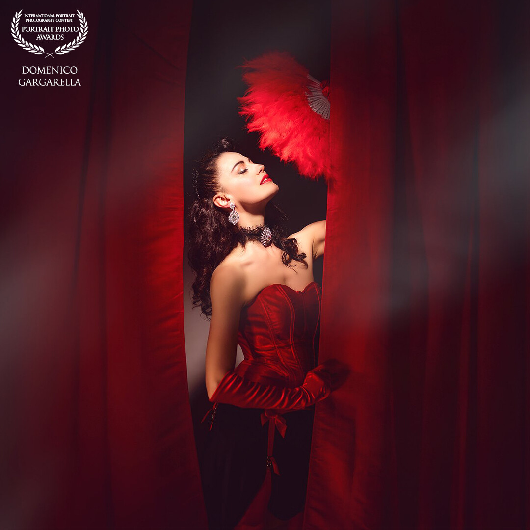 Burlesque-style photography captures the essence of bold elegance, a visual journey intertwining charm and mystery, a tribute to the art that celebrates beauty with a hint of mischief and a knowing smile