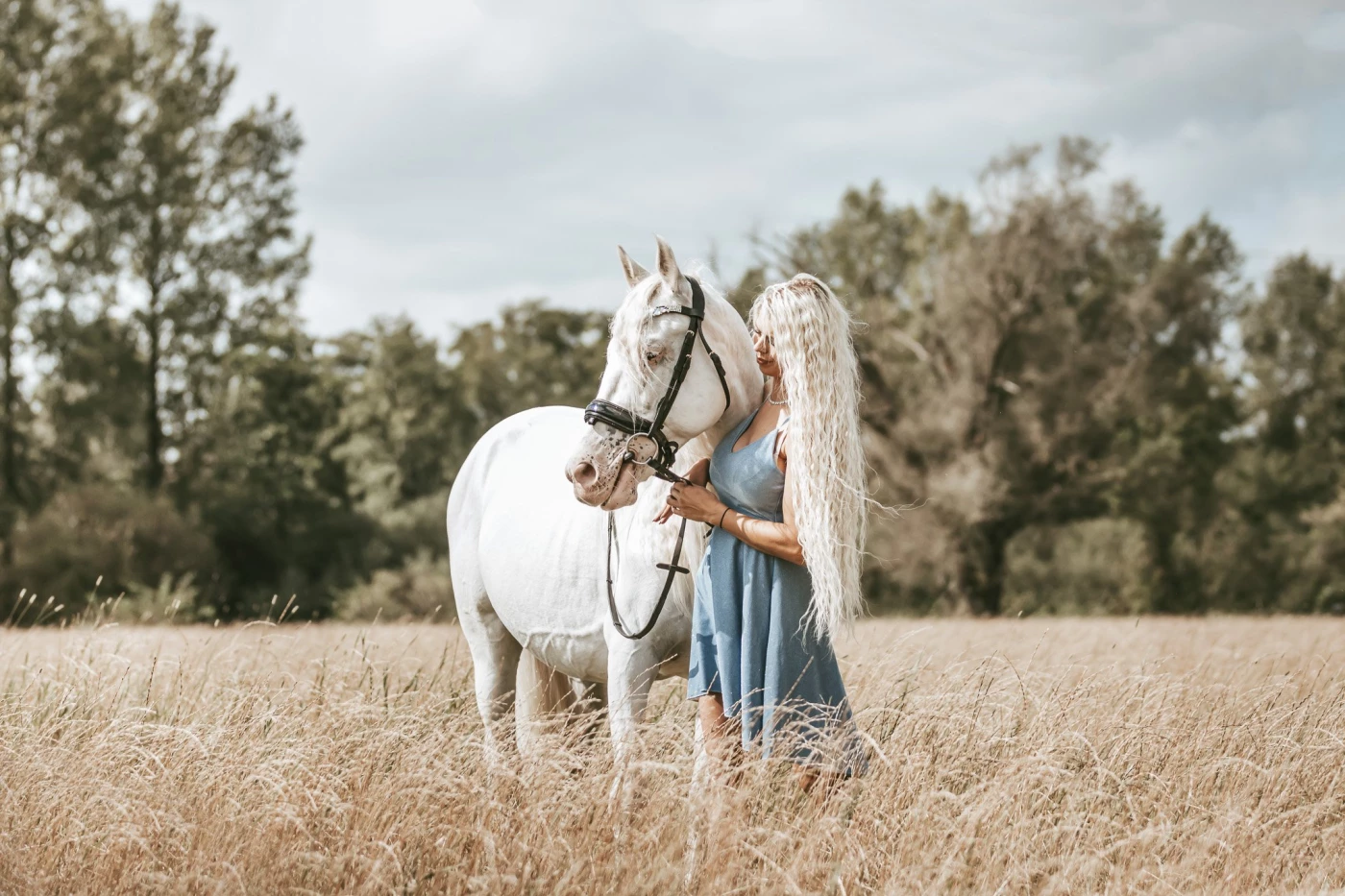 Beautiful Sanne with her white horse 'Mr. White'. She was just a week the owner of Mr. White when th...