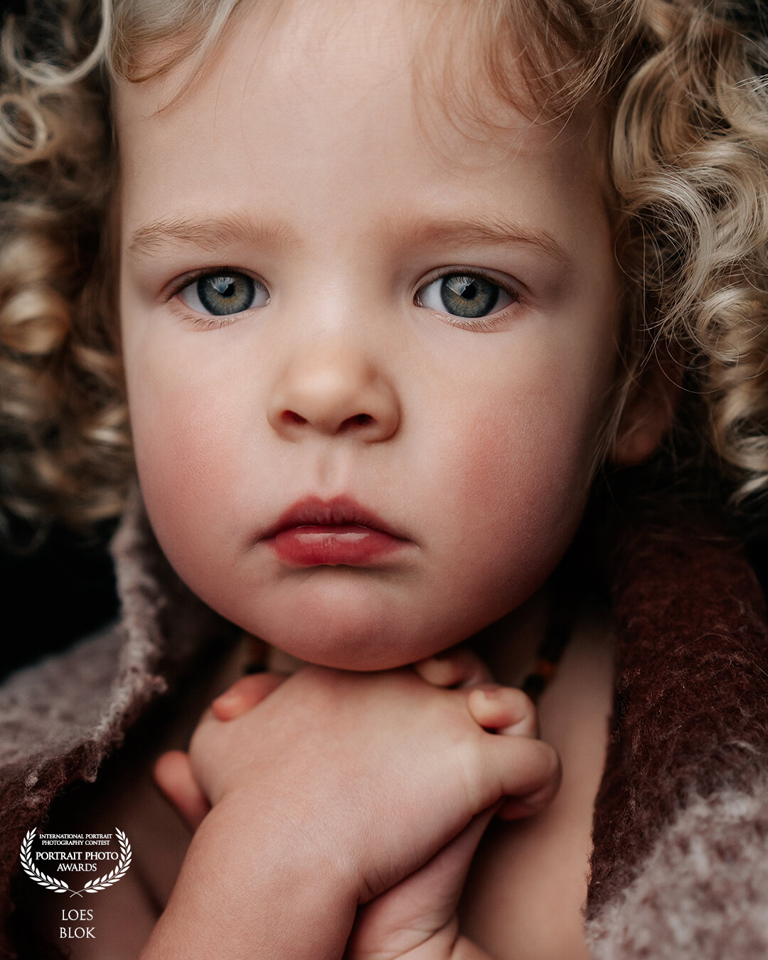 Lotte in Portrait <br />
<br />
Lotte is 3 years old. With a scarf around her because she was cold. You can see the tiny little goosebumps on her arm. In love with all these details.
