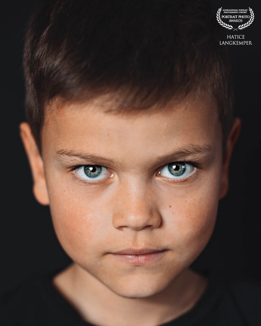 This is my son's first portrait photo. I took this photo in the livingroom. He posed like a true professional with his ice cream in his left hand.