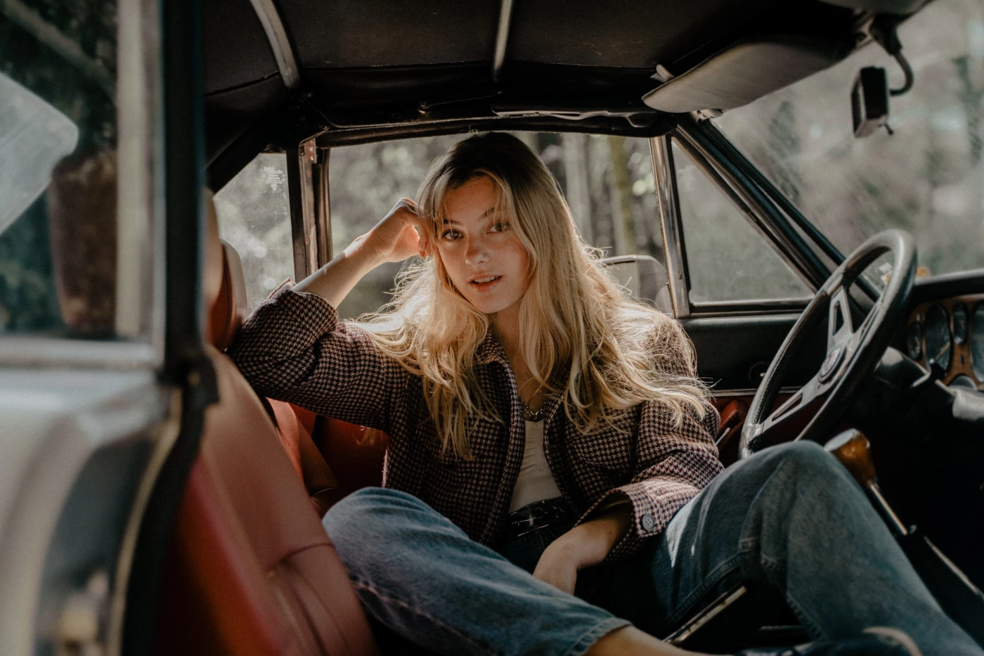 We took this picture in her father's oldtimer. The light fell beautifully on her light hair.  Singer...