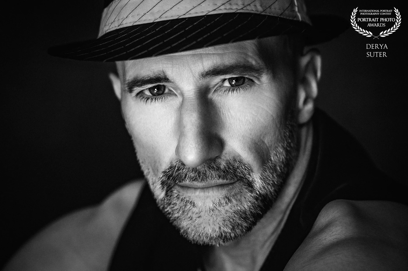 The Portrait Photo Awards proudly honors Derya Suter as one of this year’s select honorees. His arresting black-and-white portrait—remarkable for its razor-sharp detail, masterful lighting and profound emotional resonance—won special commendation from our international jury. Congratulations to Derya and all of our outstanding finalists.